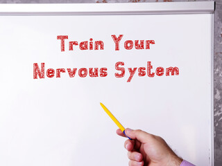 Lifestyle concept meaning Train Your Nervous System with sign on the sheet.