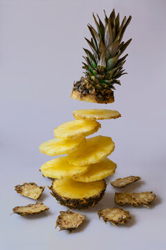Close-up Of Pineapple Slices Against White Background