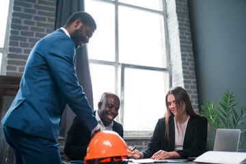 Group of business people working together in the office.