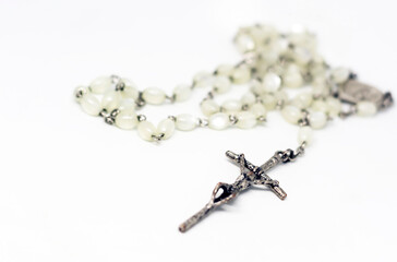 White pearl rosary isolated on a white background