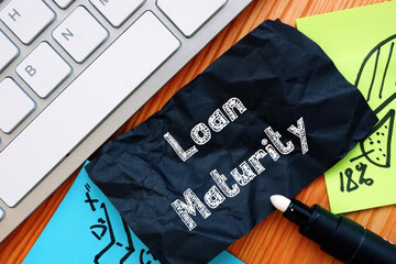 Financial concept meaning Loan Maturity with phrase on the piece of paper.