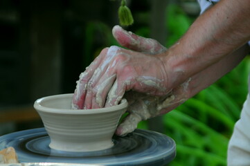 hands of a potter at work