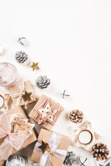 Festive Christmas background with different size gift boxes and Christmas decorations. Top view. Banner with copy space for text.