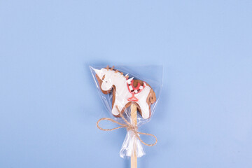 Naklejka premium sweet yummy festive colorful lollipops on light blue background. copy space for text. minimalism style