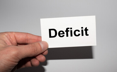 Message on the card deficit, in hands of businessman.