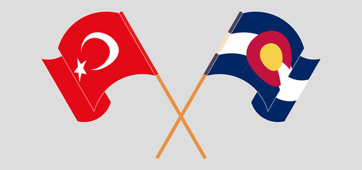 Crossed and waving flags of Turkey and The State of Colorado