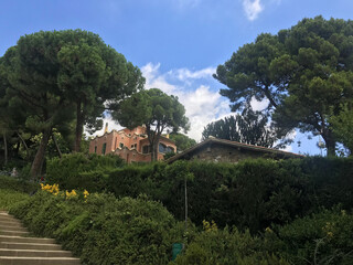 Fototapeta na wymiar garden view near Colonnaded roadway, by Antoni Gaudi in Park Guell, Barcelona, Catalonia, Spain