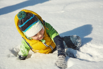active little boy walking in the winter - 394774655
