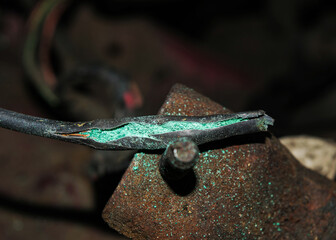 Oxidized damaged ignition wire in the car. The ignition switch wire is broken. Broken wire. Broken chain. Wire break.