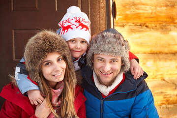 winter portrait of a family in the winter - 394775205