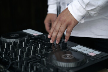 DJ at the remote at a party