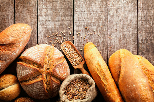 Directly Above View Of Baked Bread And Wheat On Table