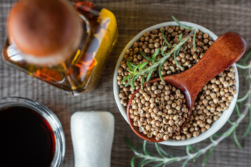 Coriander seeds in a bowl on the kitchen table.
