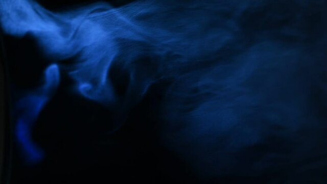 blue smoke on a black background, fog on a dark background