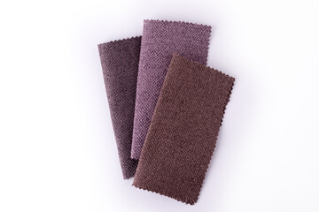 Trendy colors gunny textile samples on a white background.