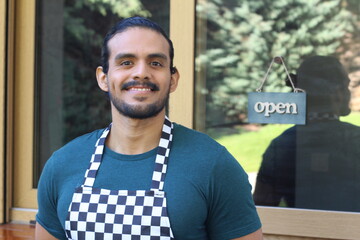 Handsome ethnic barista at work 