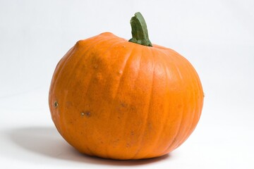 Orange pumpkin isolated on white background - concept for Thanksgiving or Halloween.