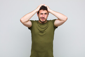 young man feeling frustrated and annoyed, sick and tired of failure, fed-up with dull, boring tasks