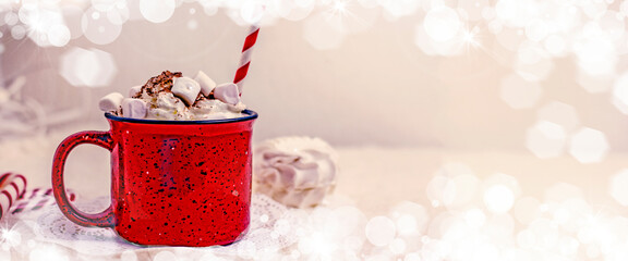 Hot cocoa with marshmallows in a red mug banner, copy space. Winter hot drink concept, hygge...