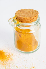 ground turmeric in a glass jar
