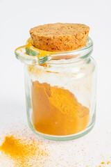 ground turmeric in a glass jar
