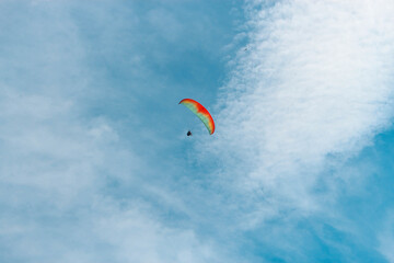 paragliding in the blue sky