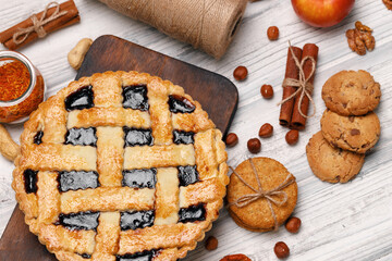 Berry tart pie on white wooden table