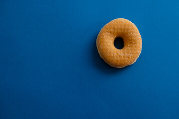 a donut on blue background