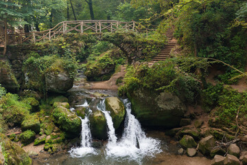 Mullerthal trail waterfall in the Mullerthal region of Luxembourg