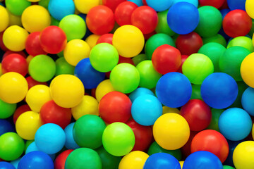 Fototapeta na wymiar Top view of many colorful balls in ball pool at indoors playground