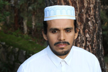 Man wearing embroidery pray skull cap