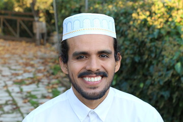 Man wearing embroidery pray skull cap
