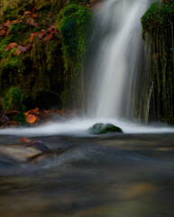Fototapeta na wymiar A small waterfall at autumn in jena germany europe