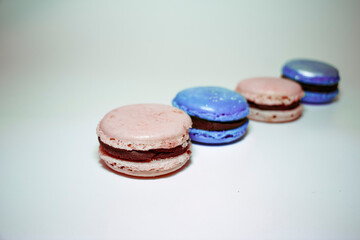 
Pink and blue macaroons on white background