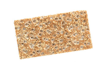 Single slice of dry crispy bread with sesame isolated on a white background in close-up