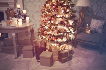 Luxury interior of living room with decorated Christmas tree and gifts on the wooden floor