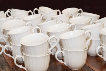 white stacked coffee cups on a wooden table
