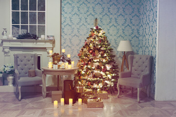 Luxury interior of living room with decorated Christmas tree and gifts on the wooden floor