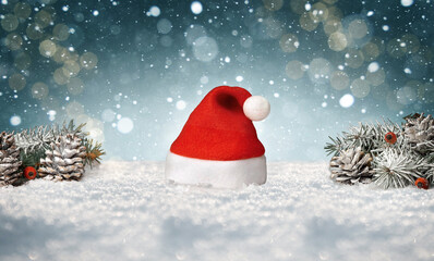 Santa hat isolated in snow with christmas decoration. 