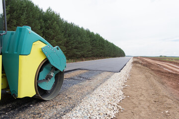 Special road vehicles. Compactor At Road Compaction Works. A roller compacting asphalt on a road