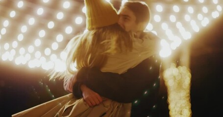 Couple stand hugging outdoors. Boyfriend making holiday surprise to his woman celebrating together giving christmas present. Gift box. Slow motion - Powered by Adobe