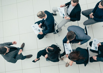 top view. project Manager at a meeting with the working group.