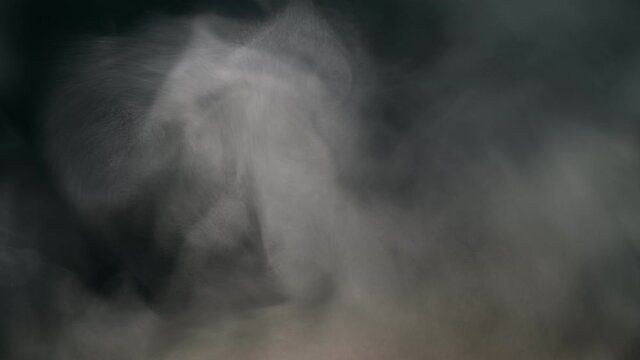 Grey smoke on a black background, fog on a dark background