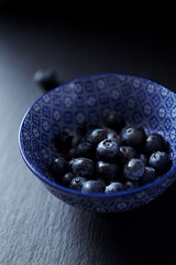 Bilberries on dark background. Close up.