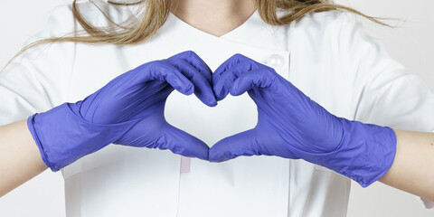 Medicine and health concept. The woman doctor folded the heart symbol, meaning that everything is...