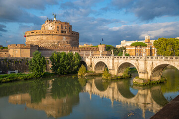 Beautiful view of Castel Sant'Angelo, or Hadrian's Mausoleum, near the Vatican, as it is reflected in the Tiber with the Ponte degli Angeli, on an autumn day. Vatican, Rome, Italy.