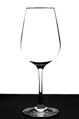 glass silhouette on a white background, black table