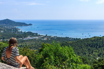 Island panoramic natural green view, girl sitting and enjoy nature