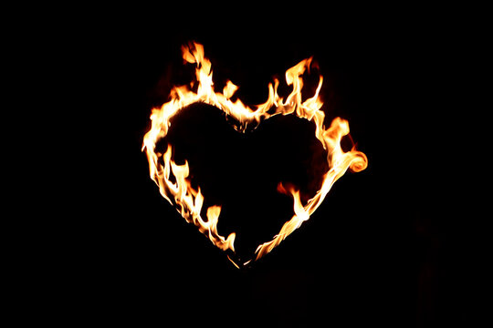 Heart Shaped Fire Against Black Background