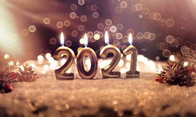 2021 candles burning in dark. new year background.